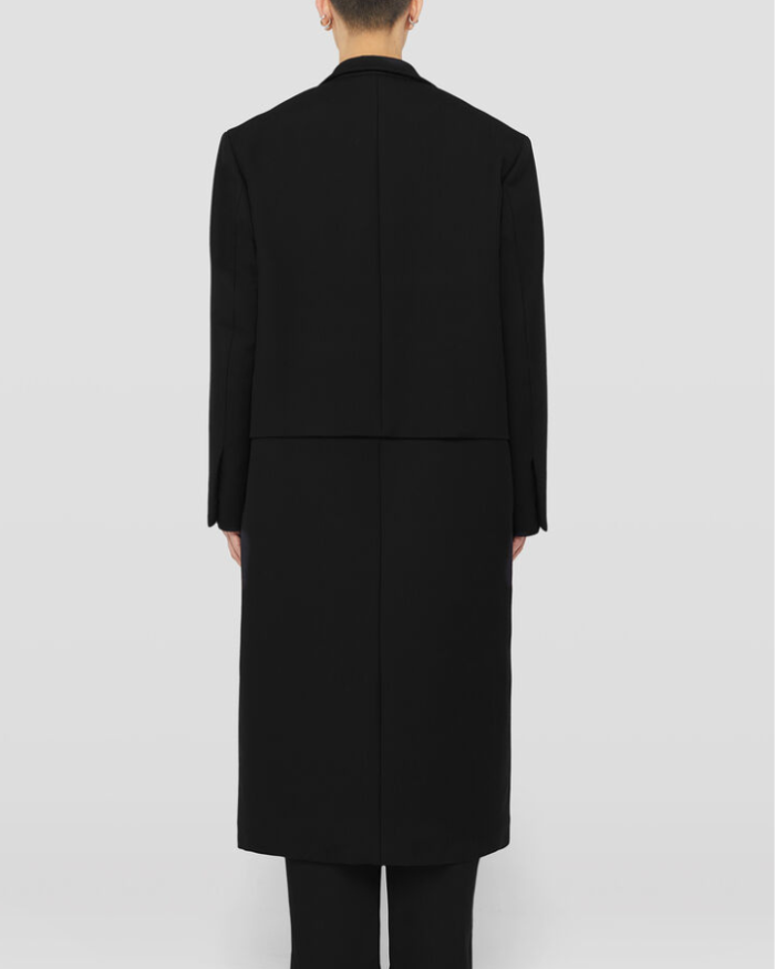 Single-breasted virgin wool coat with horizontal pleat